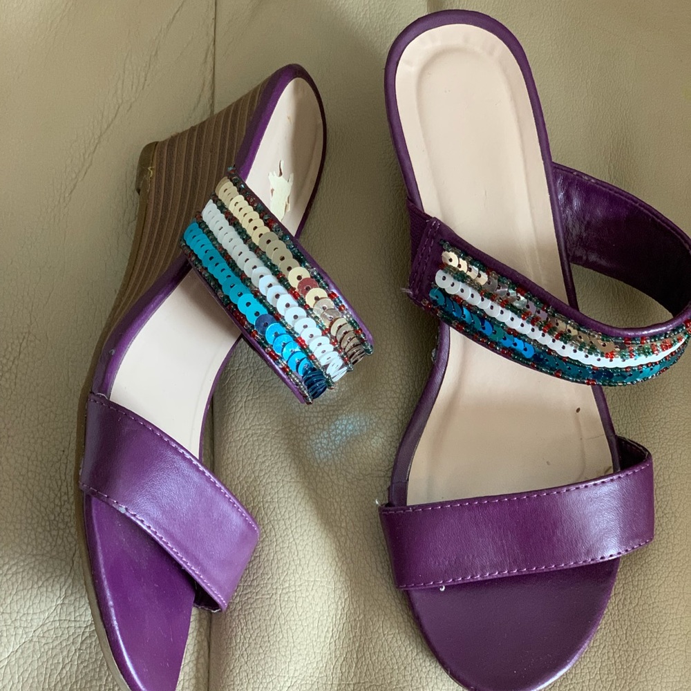 Purple sandal with sequin accent.